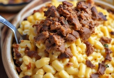 Creamy macaroni and cheese topped with savory pulled meat.