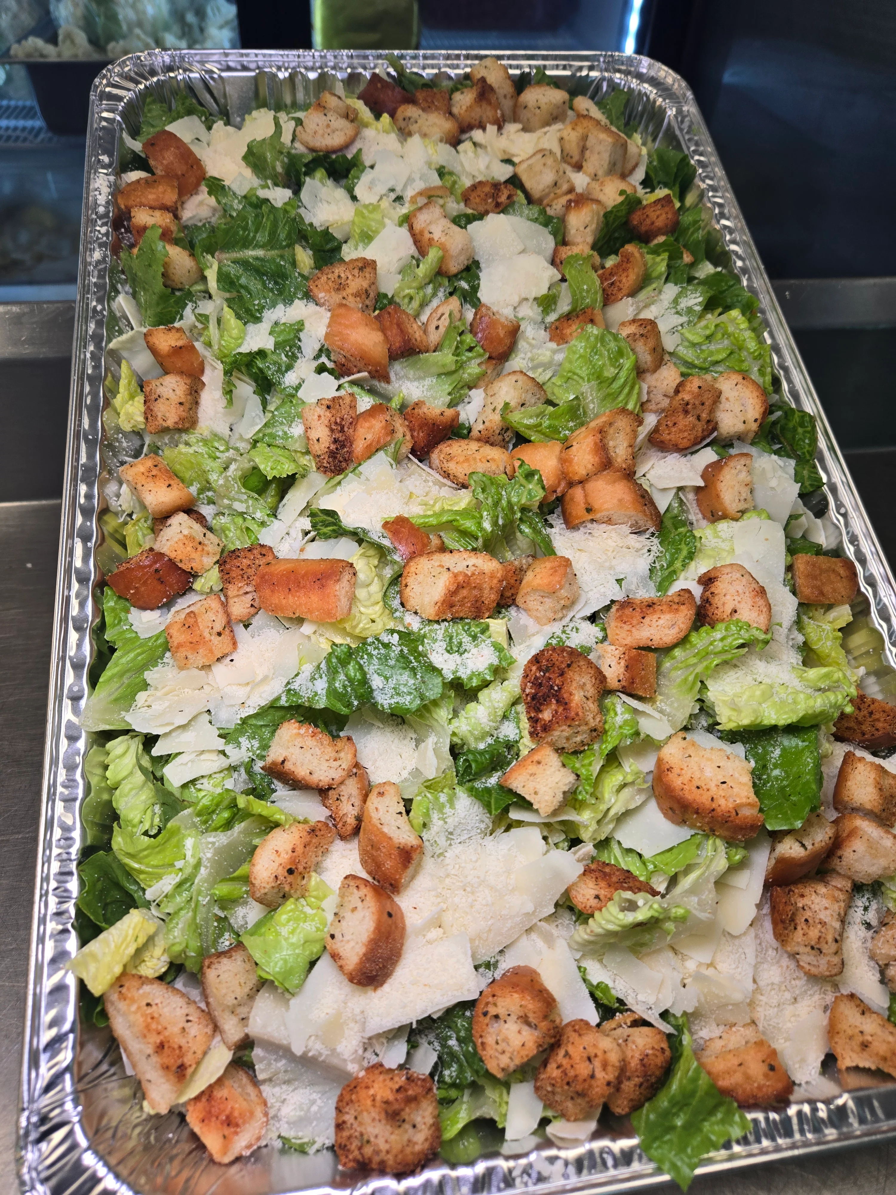 A family sized caesar salad