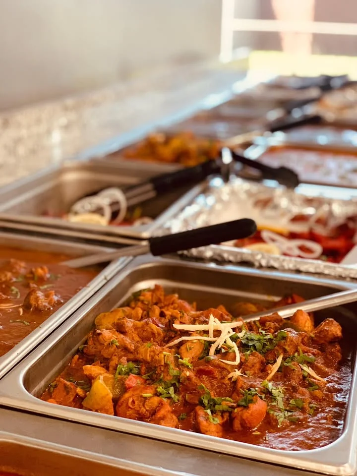 Indian chicken curry in a buffet setting