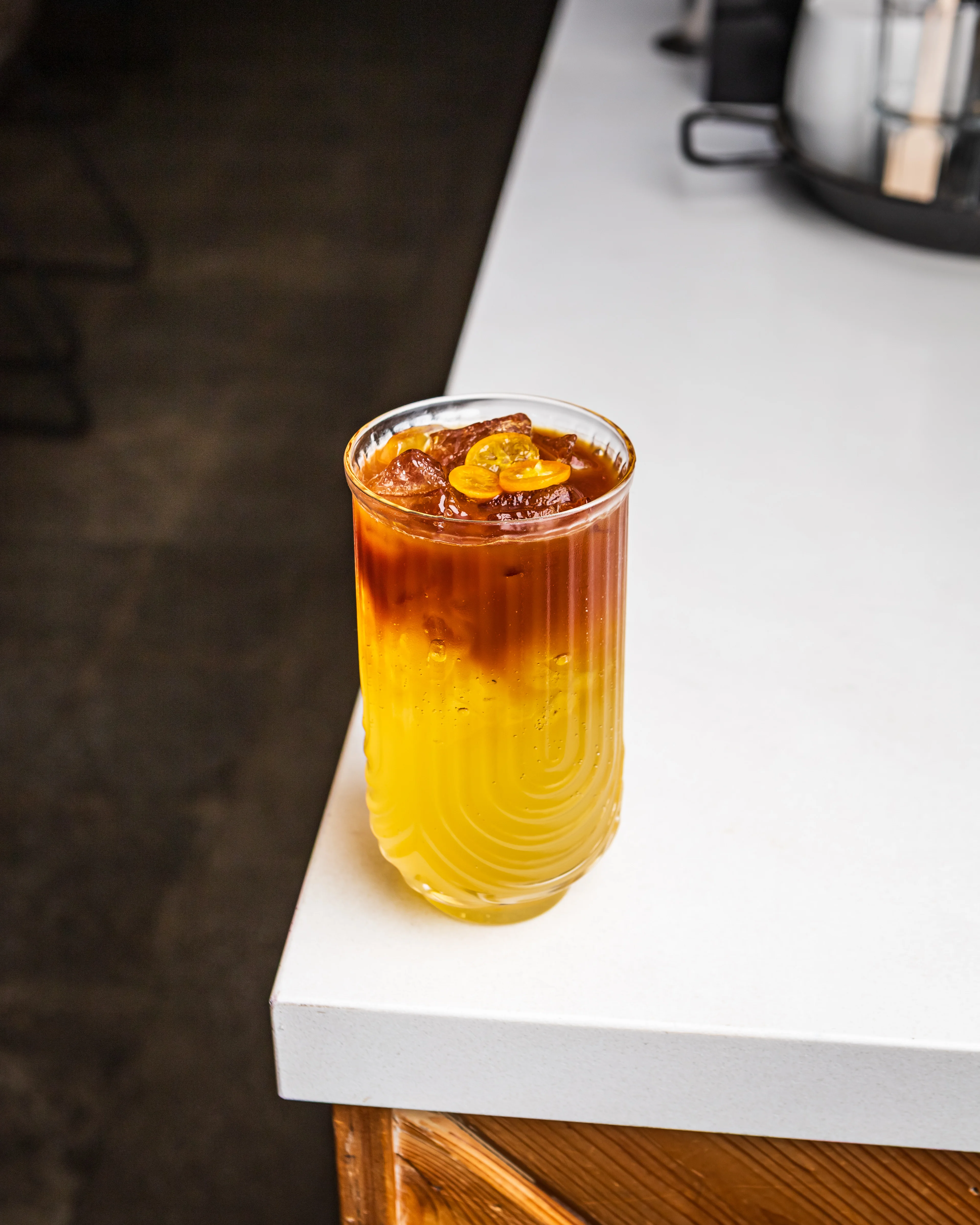 Colorful iced tea cocktail with layered flavors