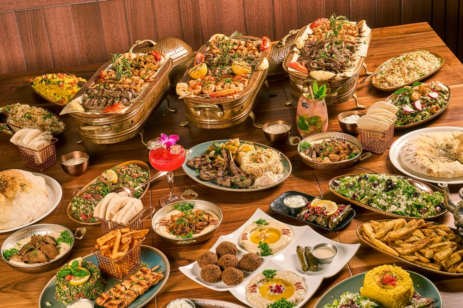 Delicious shawarma platter with fresh vegetables and sauces