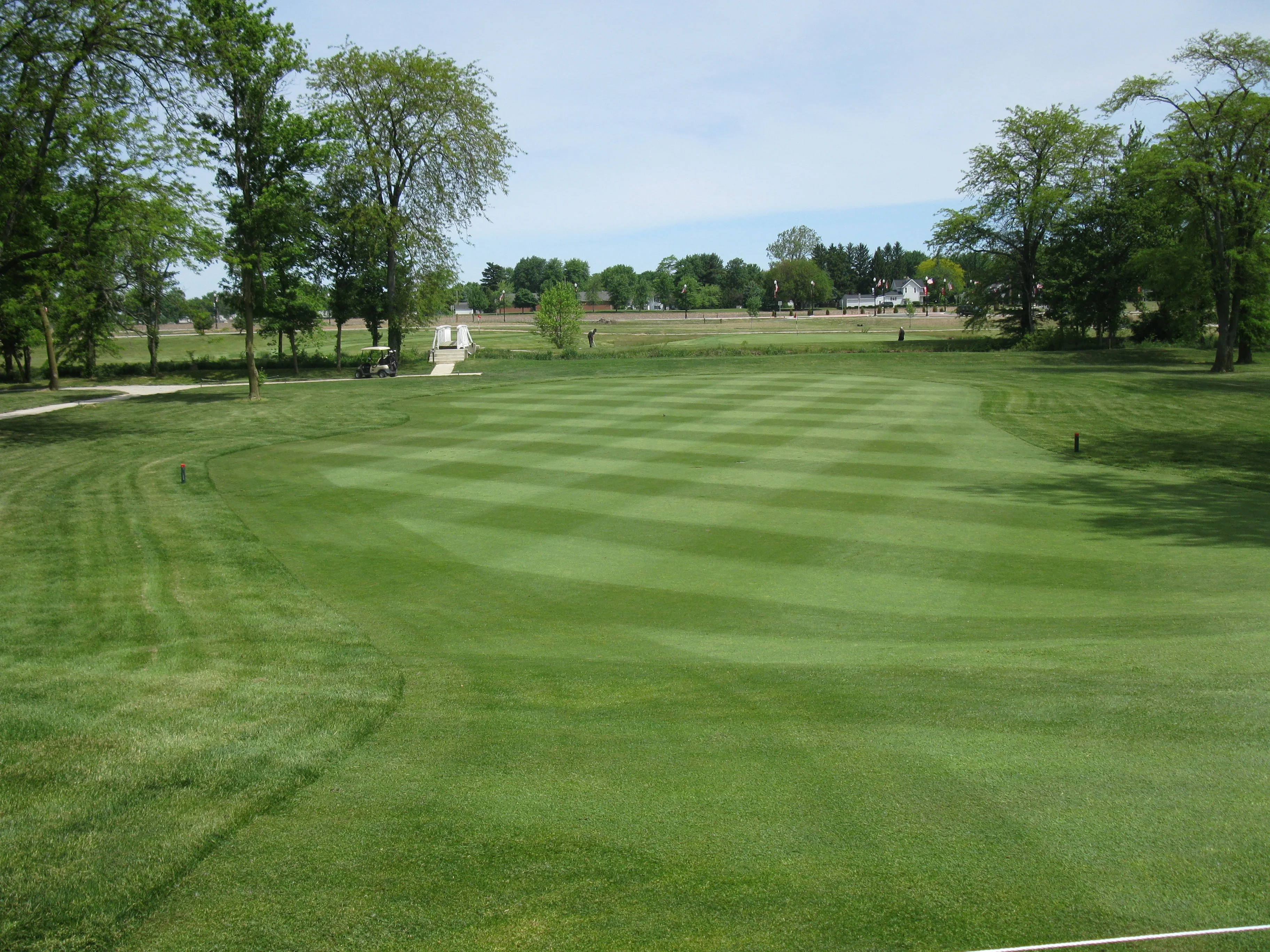 Lush green golf course with manicured fairways
