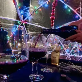 Wine being poured in an outdoor igloo at King Jugg Brewing Company