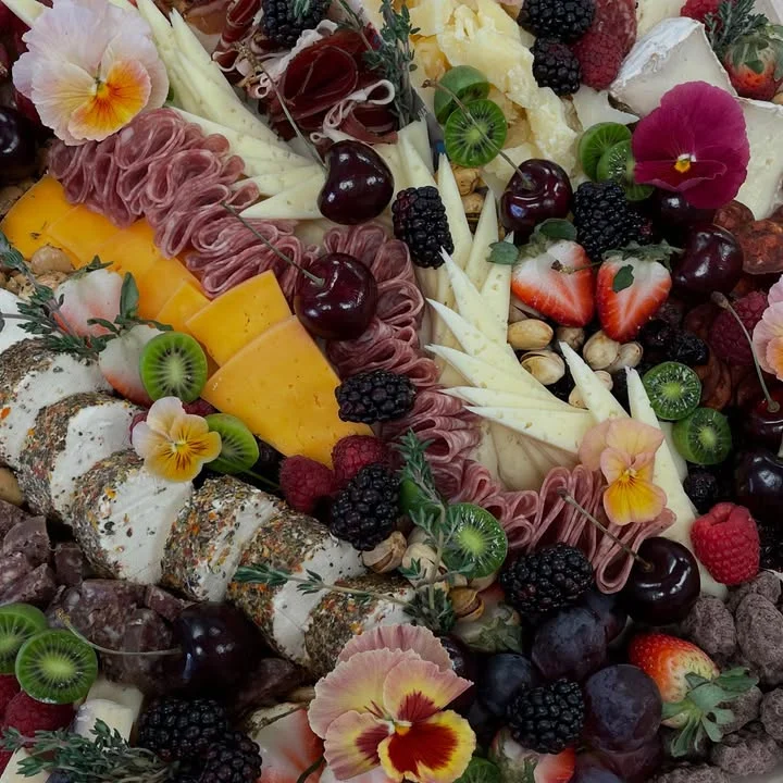 Artisan charcuterie board with cheeses and fruits