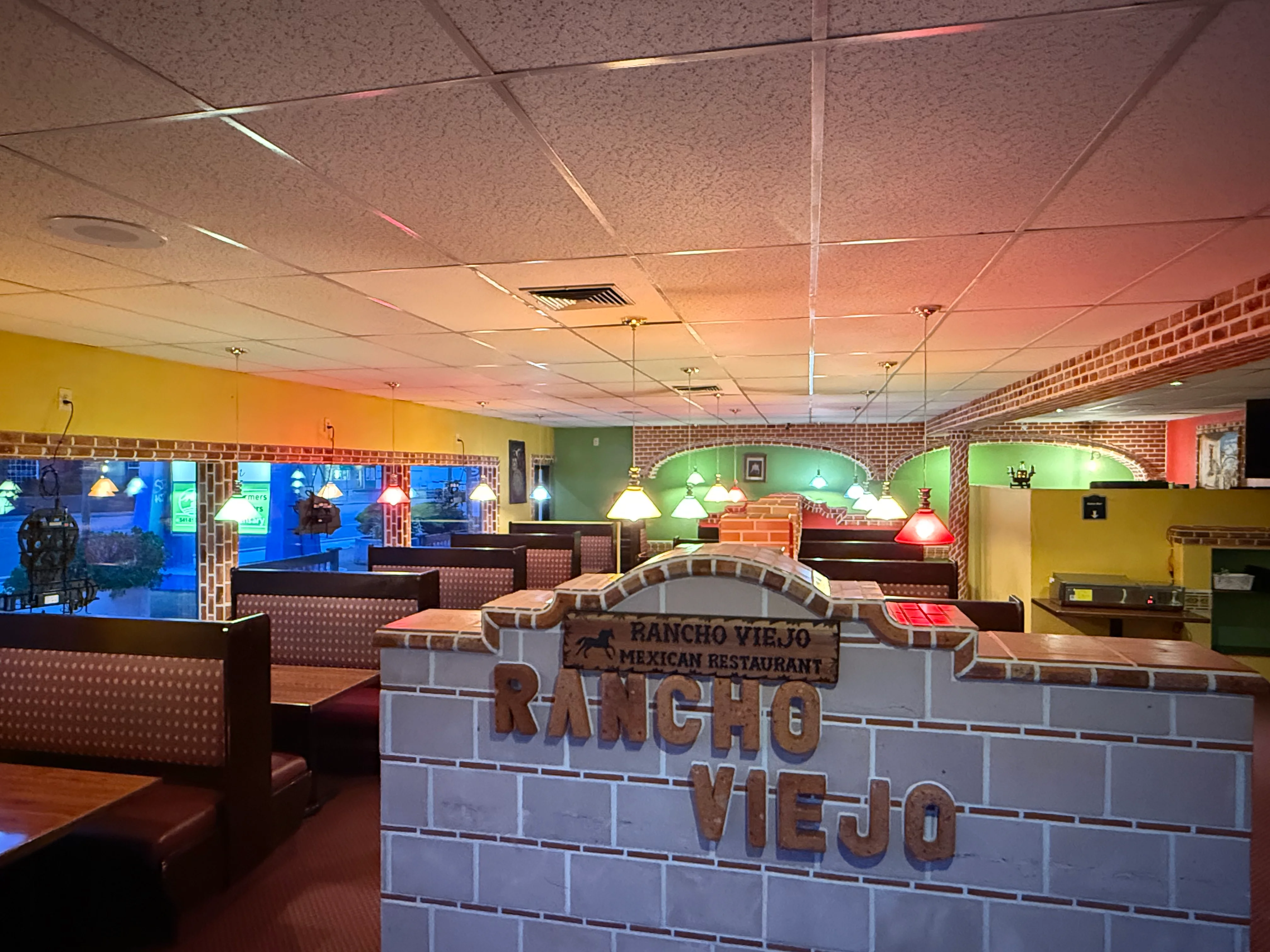 Cozy Mexican restaurant interior with colorful lighting