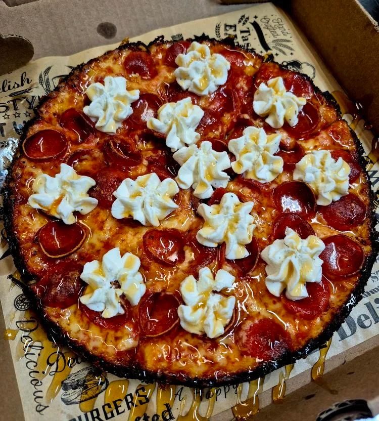 Pepperoni pizza with whipped cream topping
