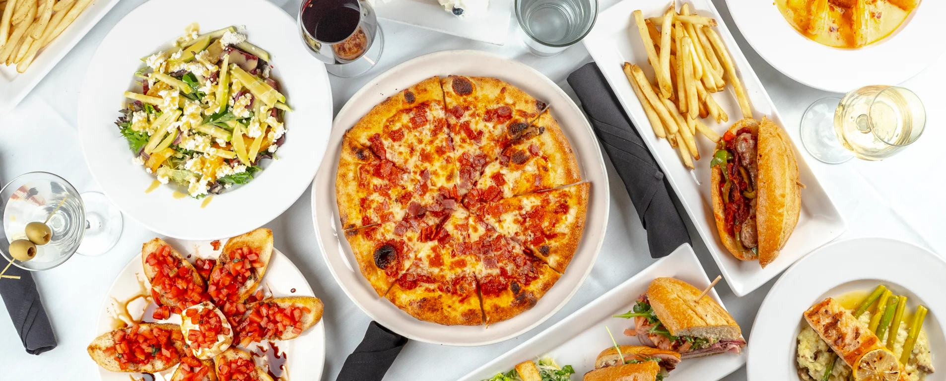 Assorted Italian dishes including pizza and bruschetta