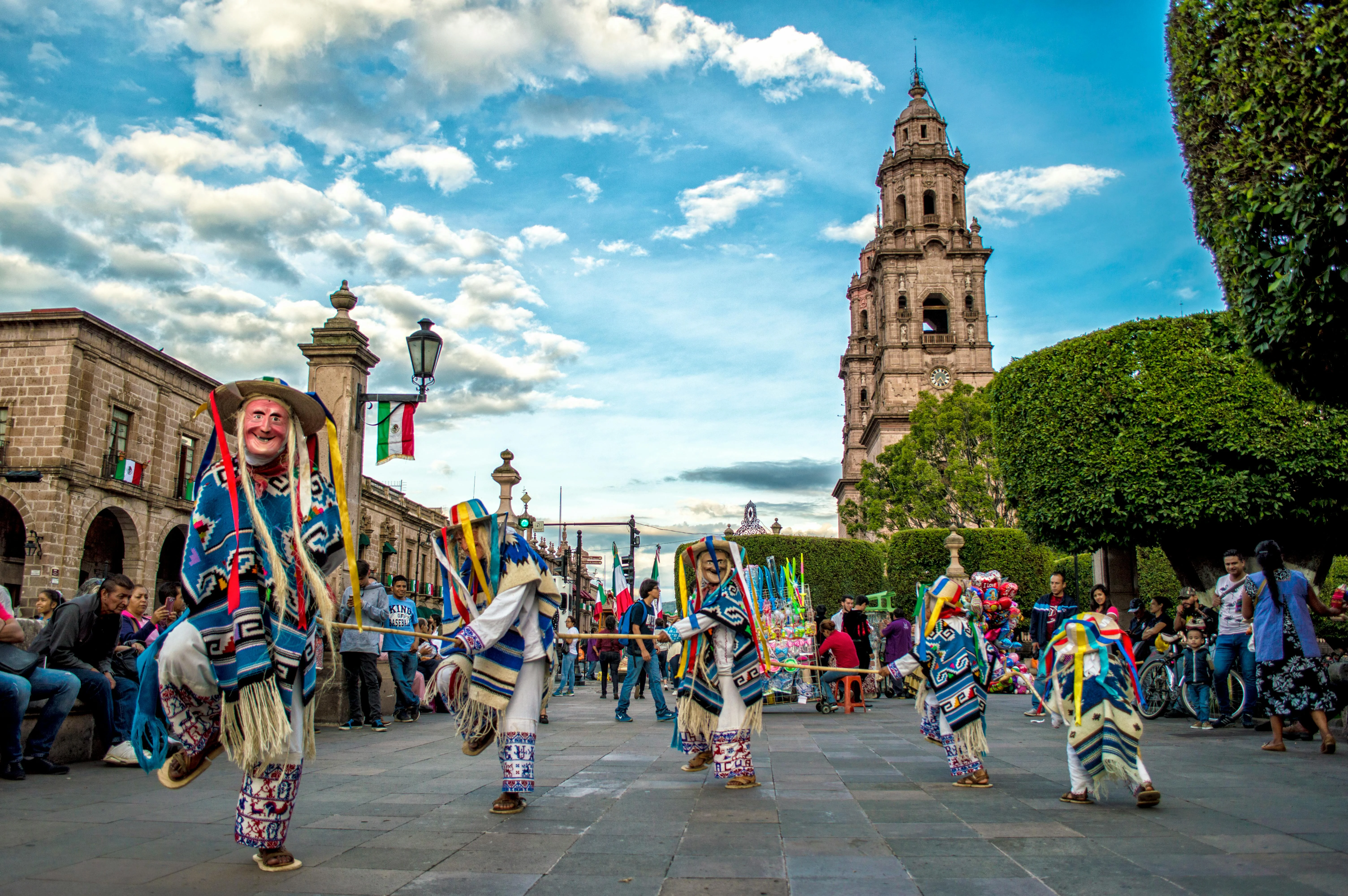Traditional dancers performing in a vibrant plaza