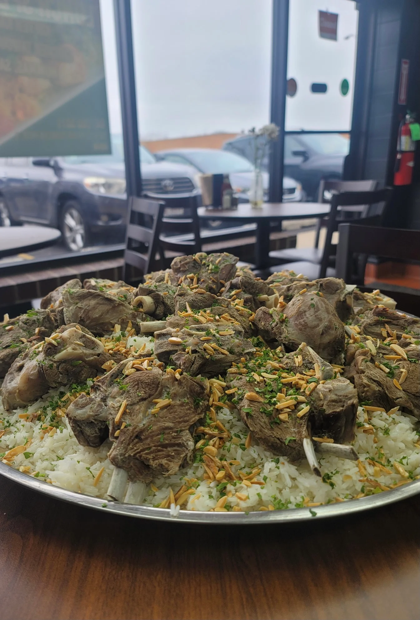 Traditional Middle Eastern lamb biryani served on a large platter