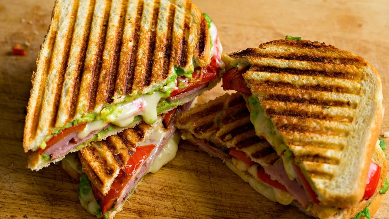 Grilled ham and cheese sandwich with fresh tomatoes