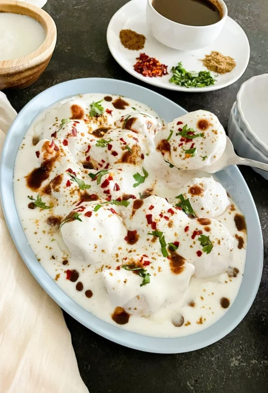 Delicious Indian dahi vada topped with yogurt and spices
