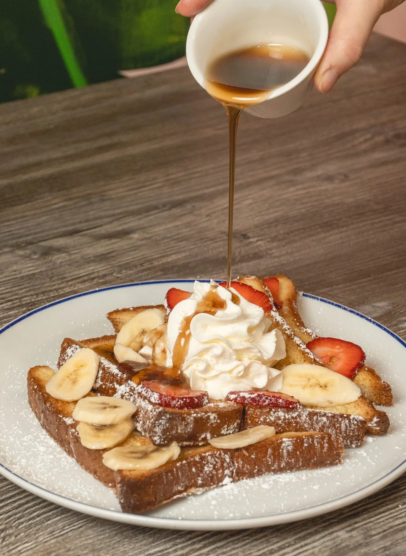 Delicious French toast topped with whipped cream and fresh fruit