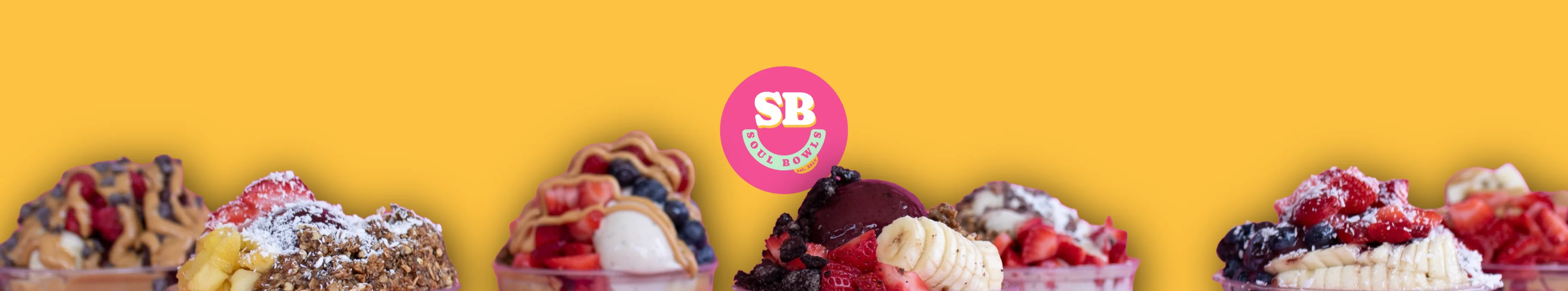 Colorful smoothie bowls with fresh fruits and toppings