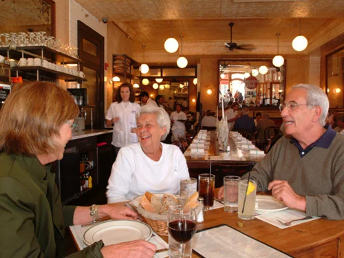 Cozy restaurant interior with diners enjoying a meal and warm ambiance