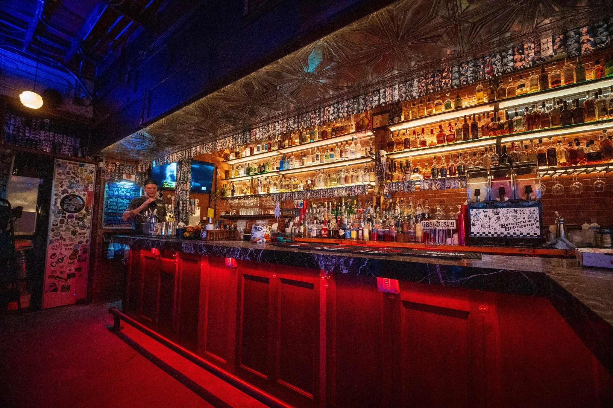 Bartender mixing cocktails at a stylish bar