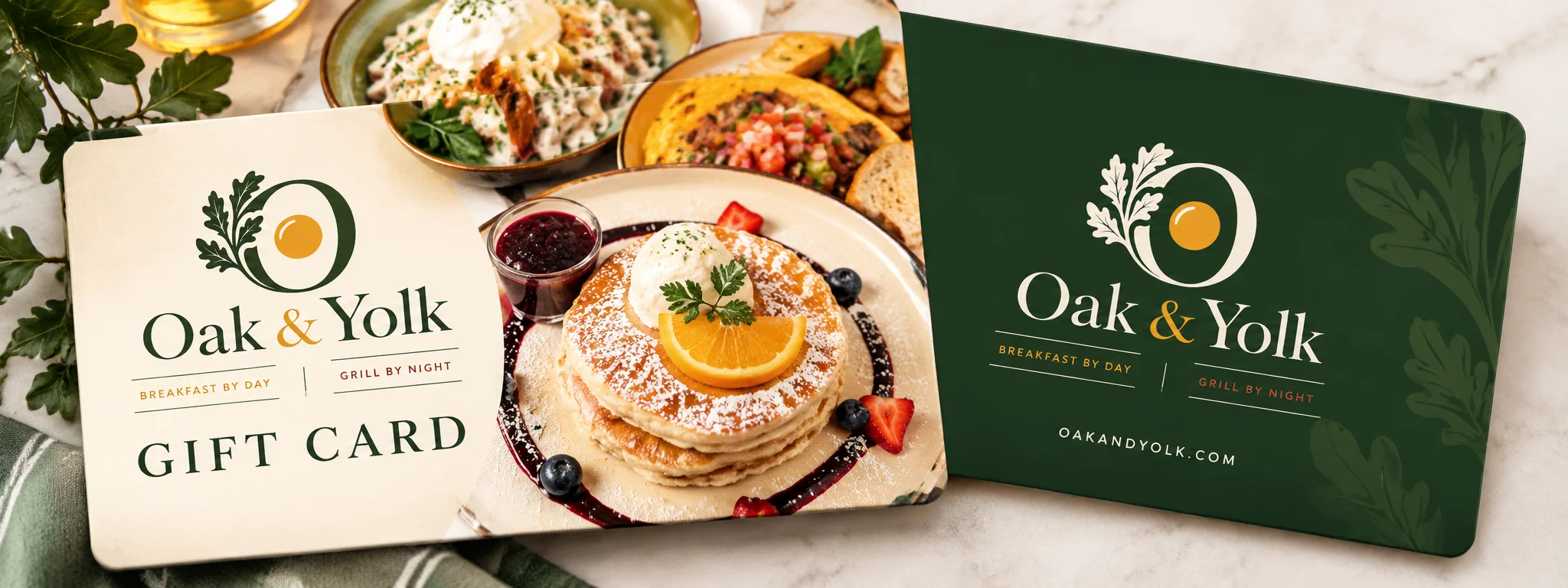 Restaurant gift cards displayed over a brunch spread with pancakes and fresh fruit