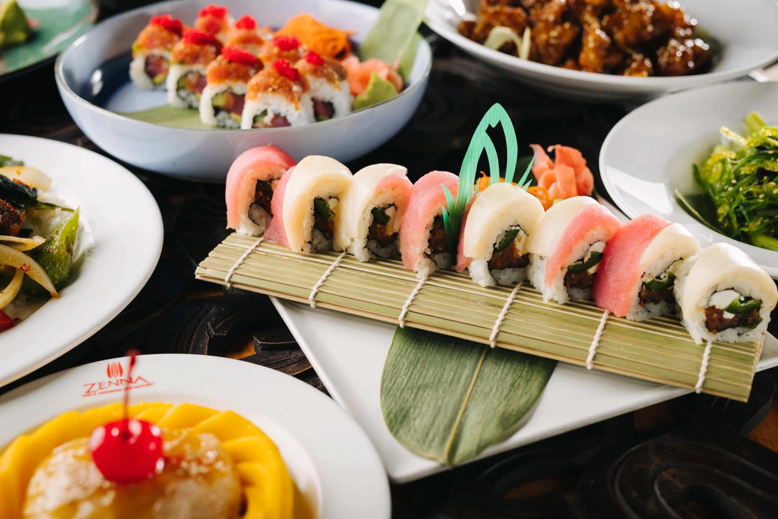 Colorful sushi rolls on a bamboo mat, showcasing Japanese cuisine
