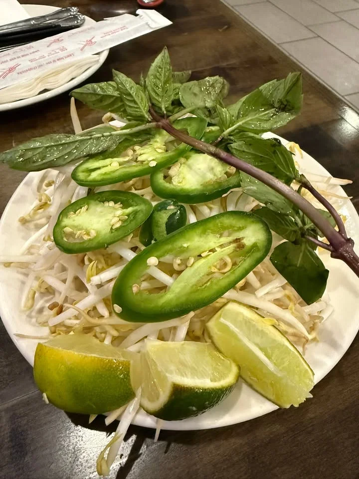 Fresh Vietnamese herbs and lime for pho