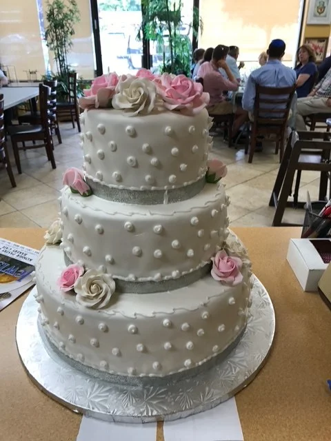 Tiered wedding cake with sugar roses from The Kosher Pastry Oven