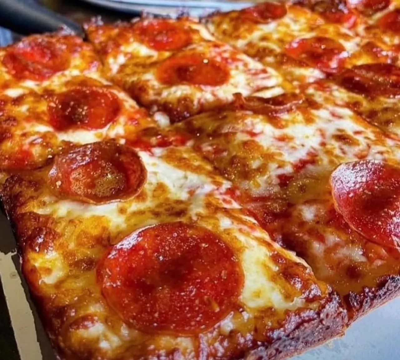 Pepperoni pizza with a crispy crust and melted cheese