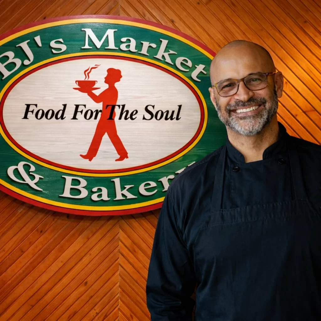Portrait of the owner of BJ's Market Bakery smiling warmly.