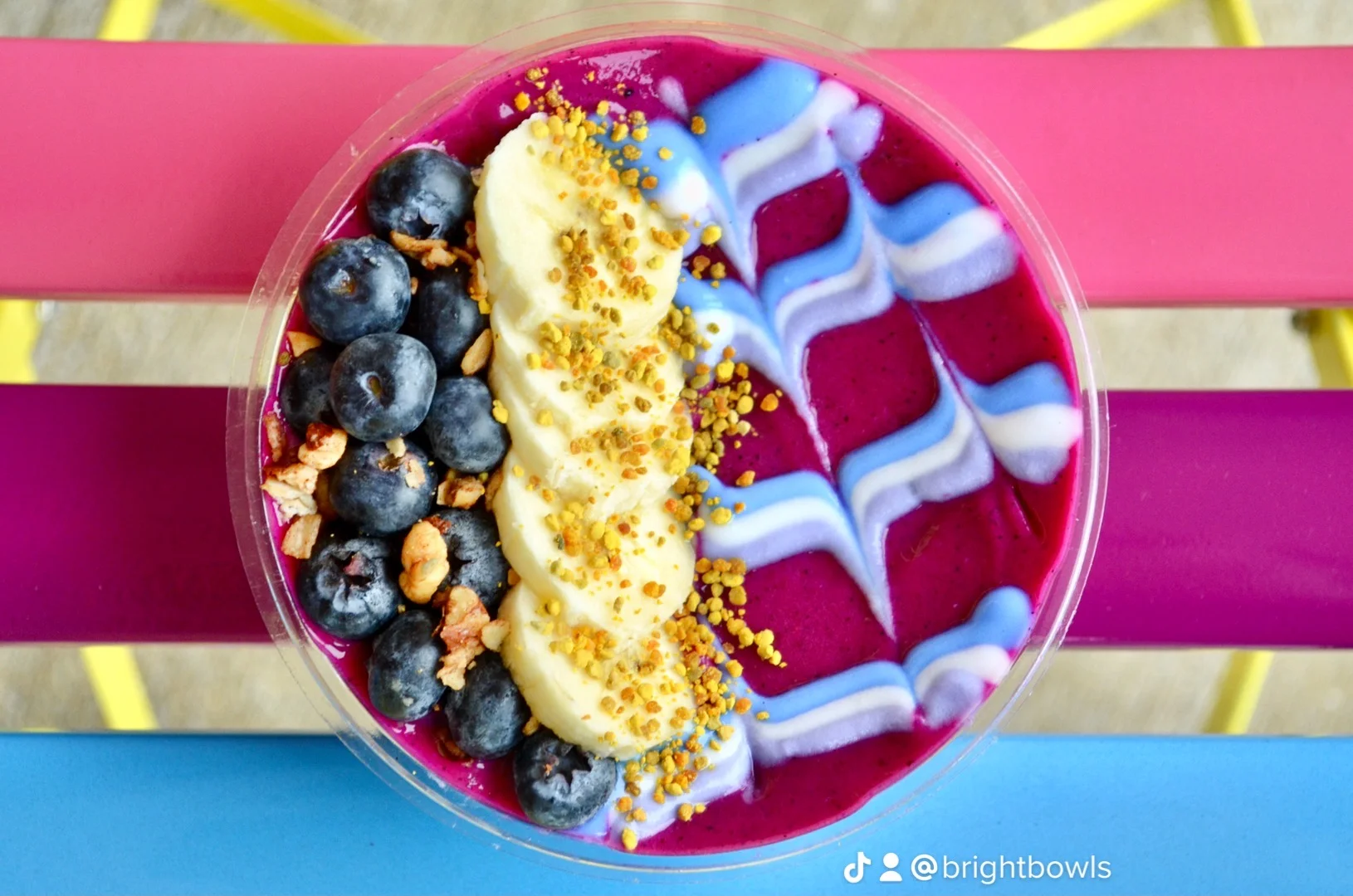 Colorful acai bowl topped with fruits and granola