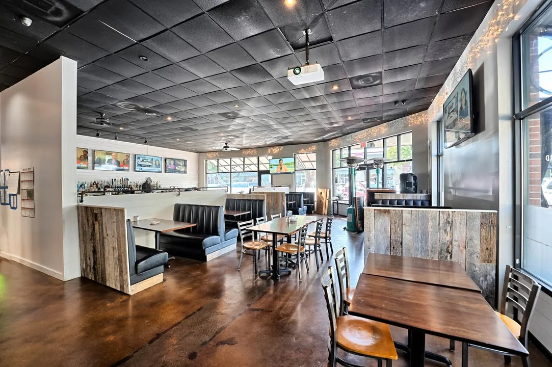 Modern restaurant interior with cozy seating and bar area
