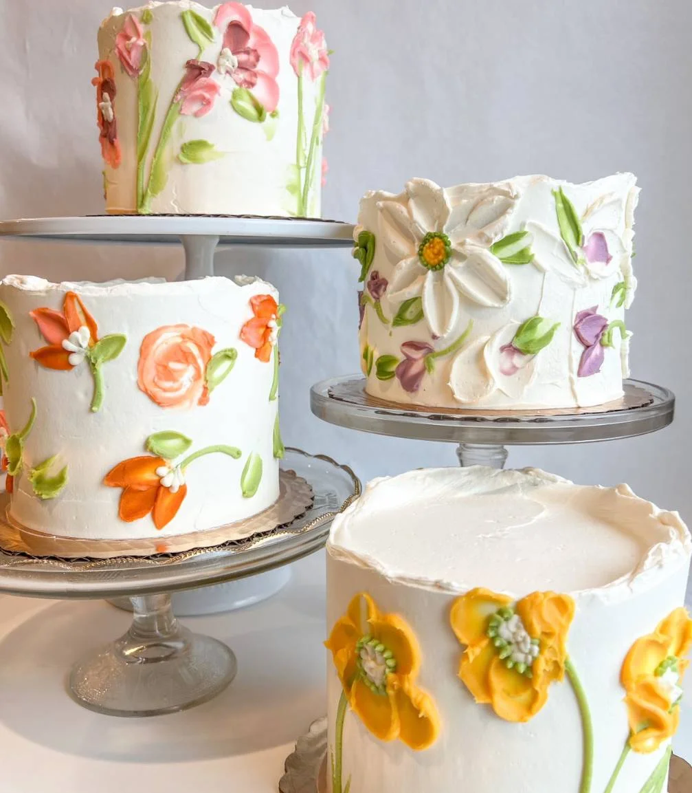 Decorative floral cakes with vibrant icing designs