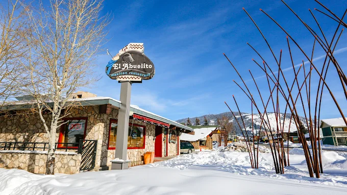 Charming Mexican restaurant exterior in snowy landscape