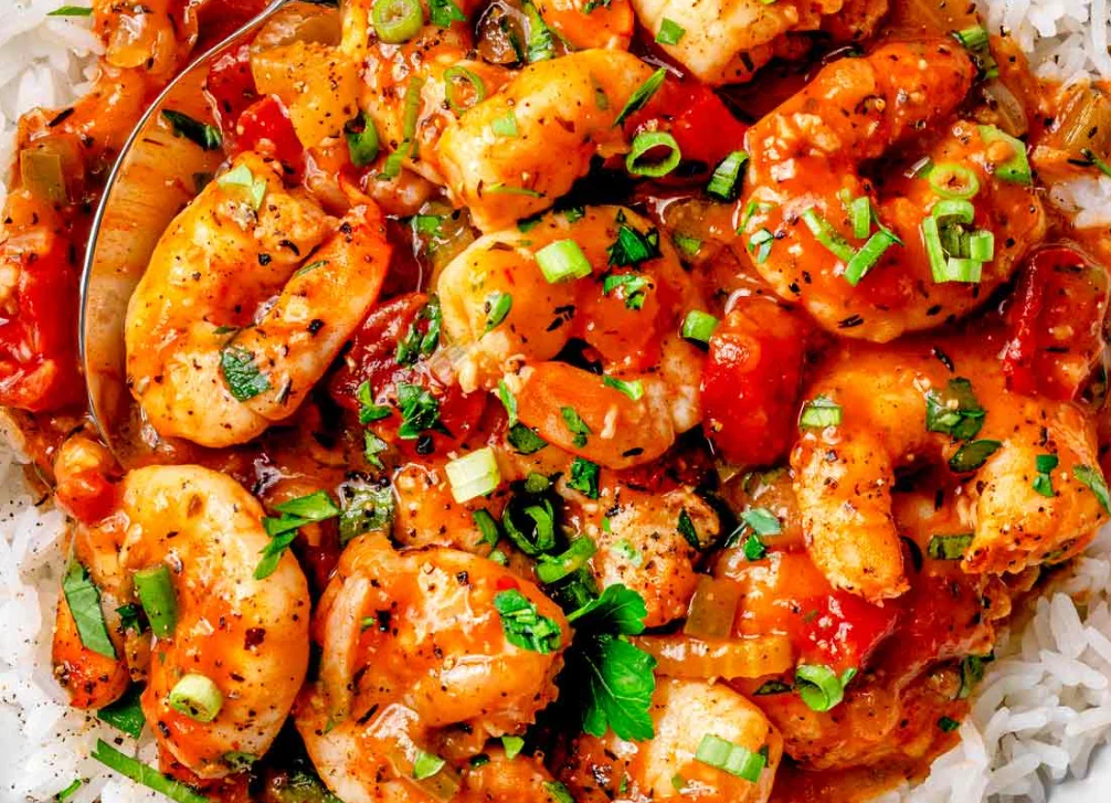 Delicious harissa lamb dish garnished with herbs and spices.