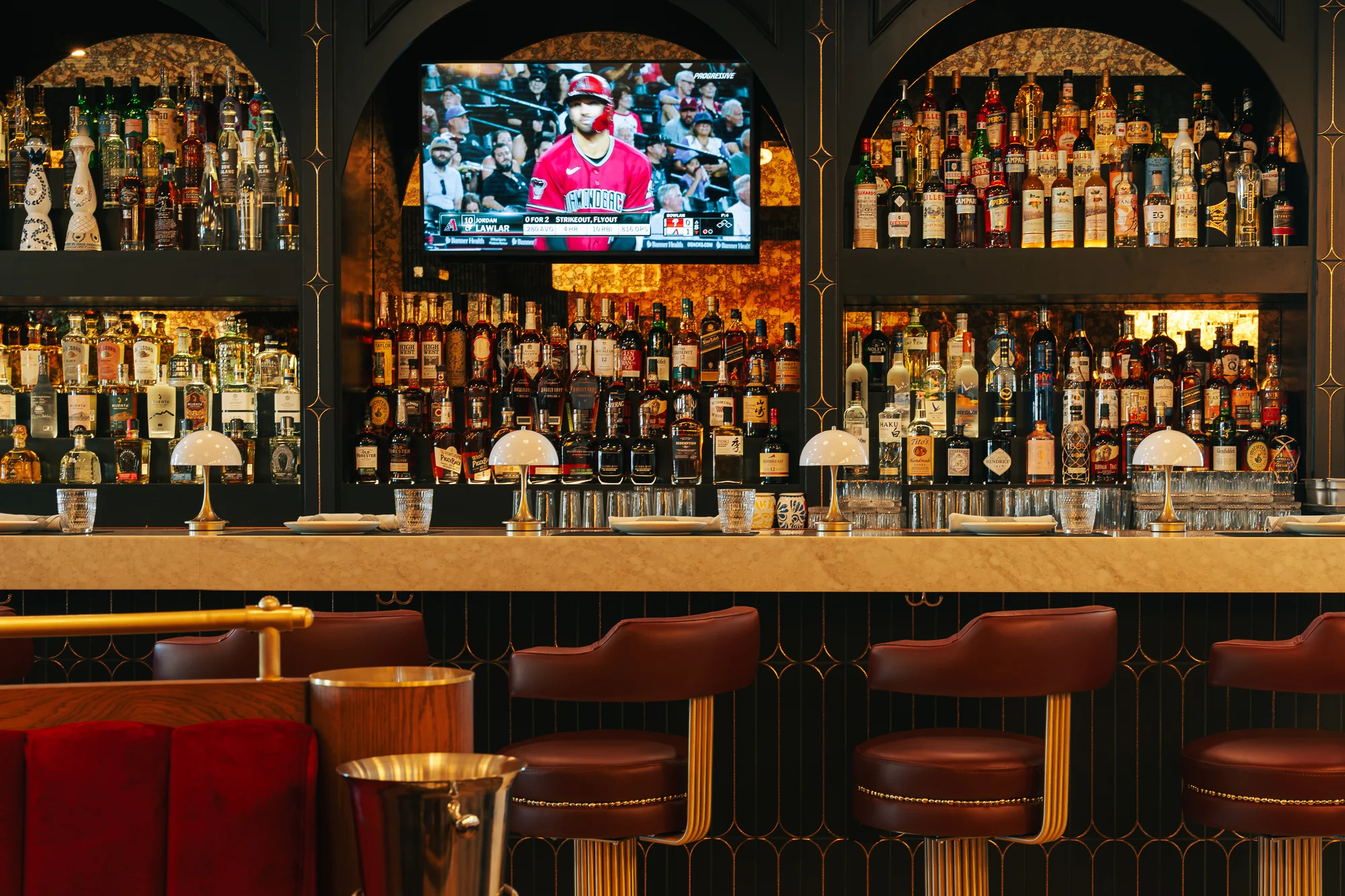 Stylish bar interior with extensive liquor selection and modern decor