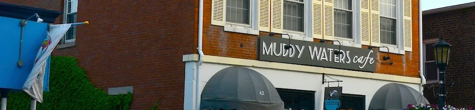 Exterior view of Muddy Waters Cafe with charming brick facade