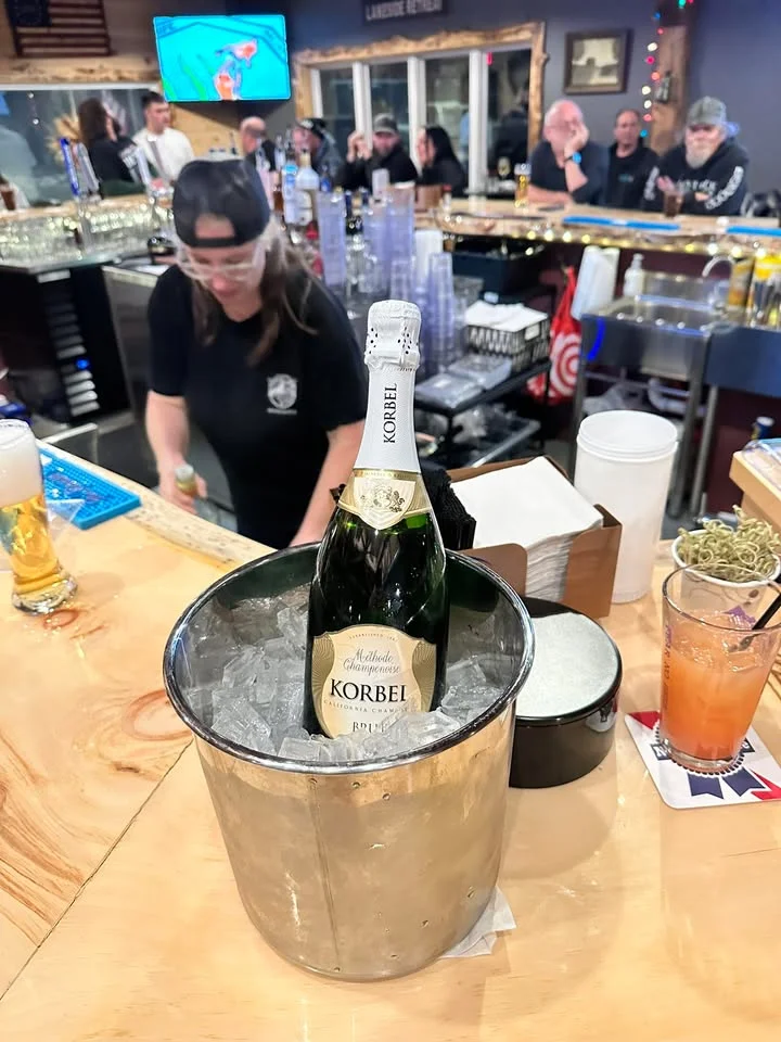 Chilled Korbel champagne in an ice bucket at a lively bar