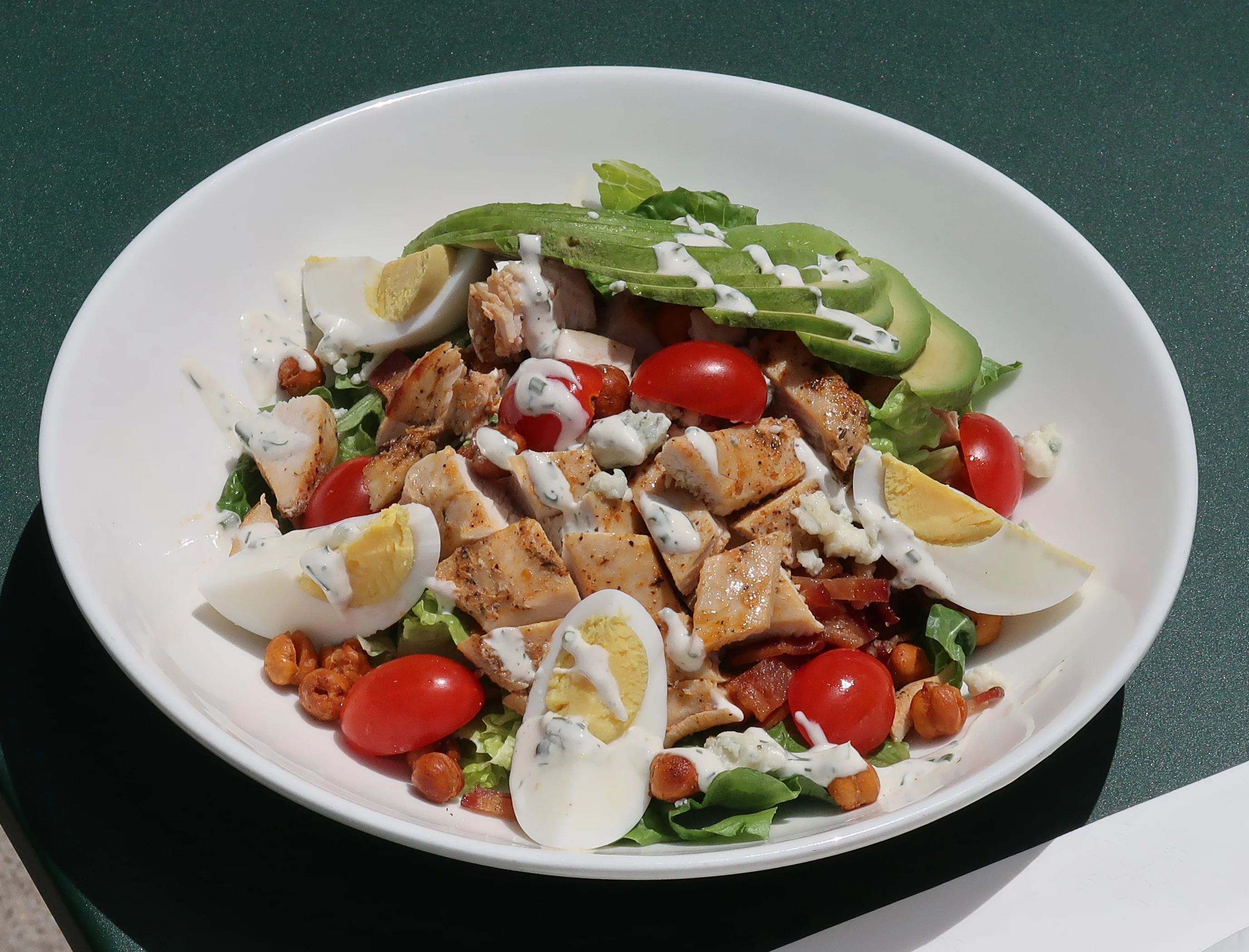 Grilled chicken salad with avocado and cherry tomatoes