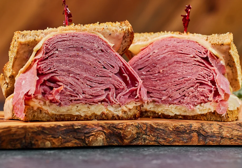 Stacked corned beef sandwich on rye bread