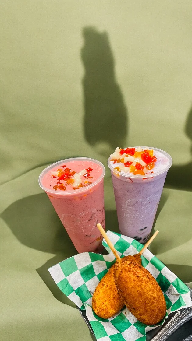 Colorful bubble tea drinks with corn dogs