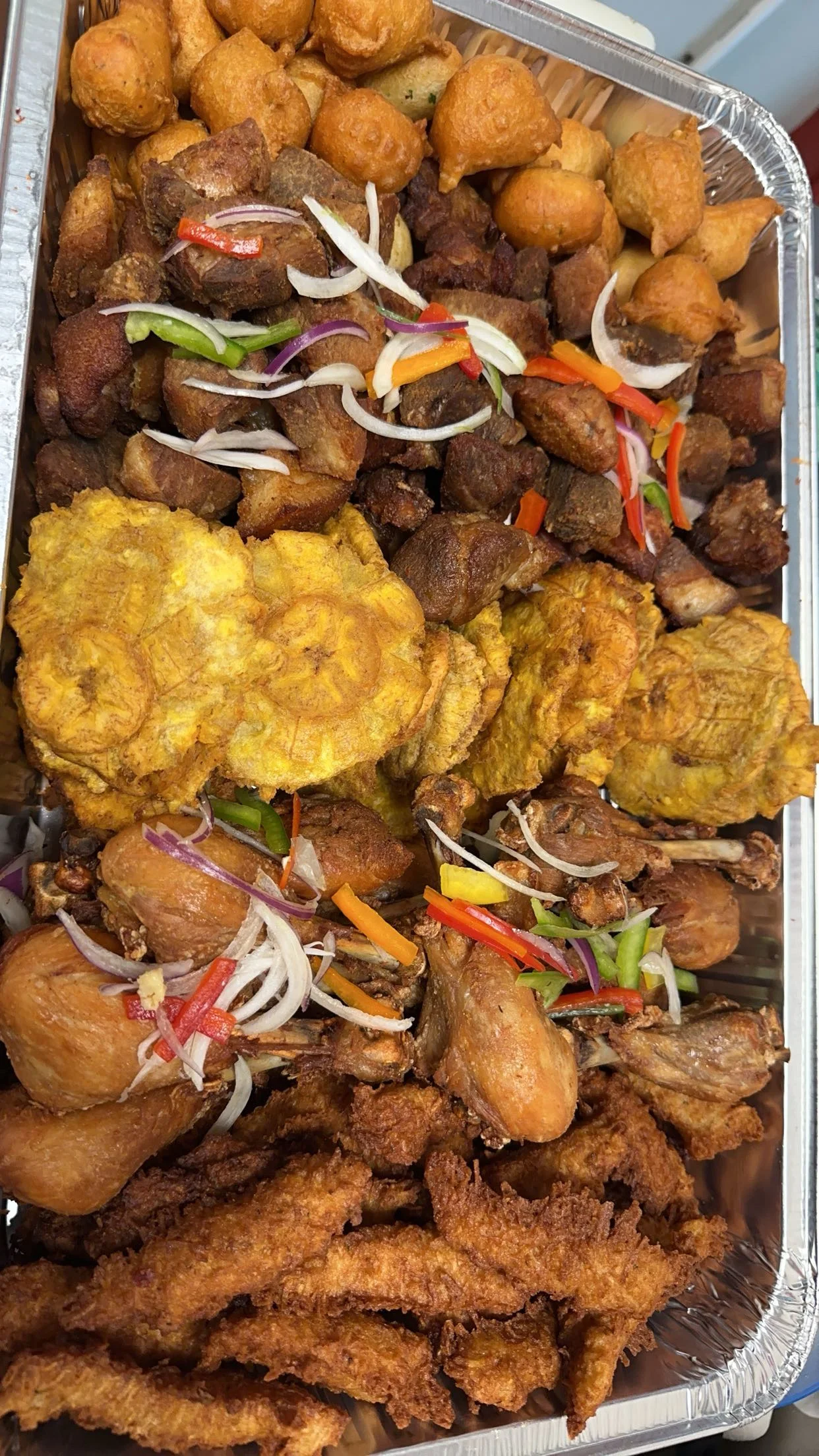 Assorted Caribbean fried snacks and meats platter
