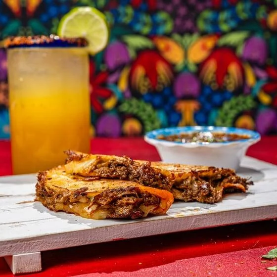 Crispy Mexican quesabirria tacos with consommé for dipping