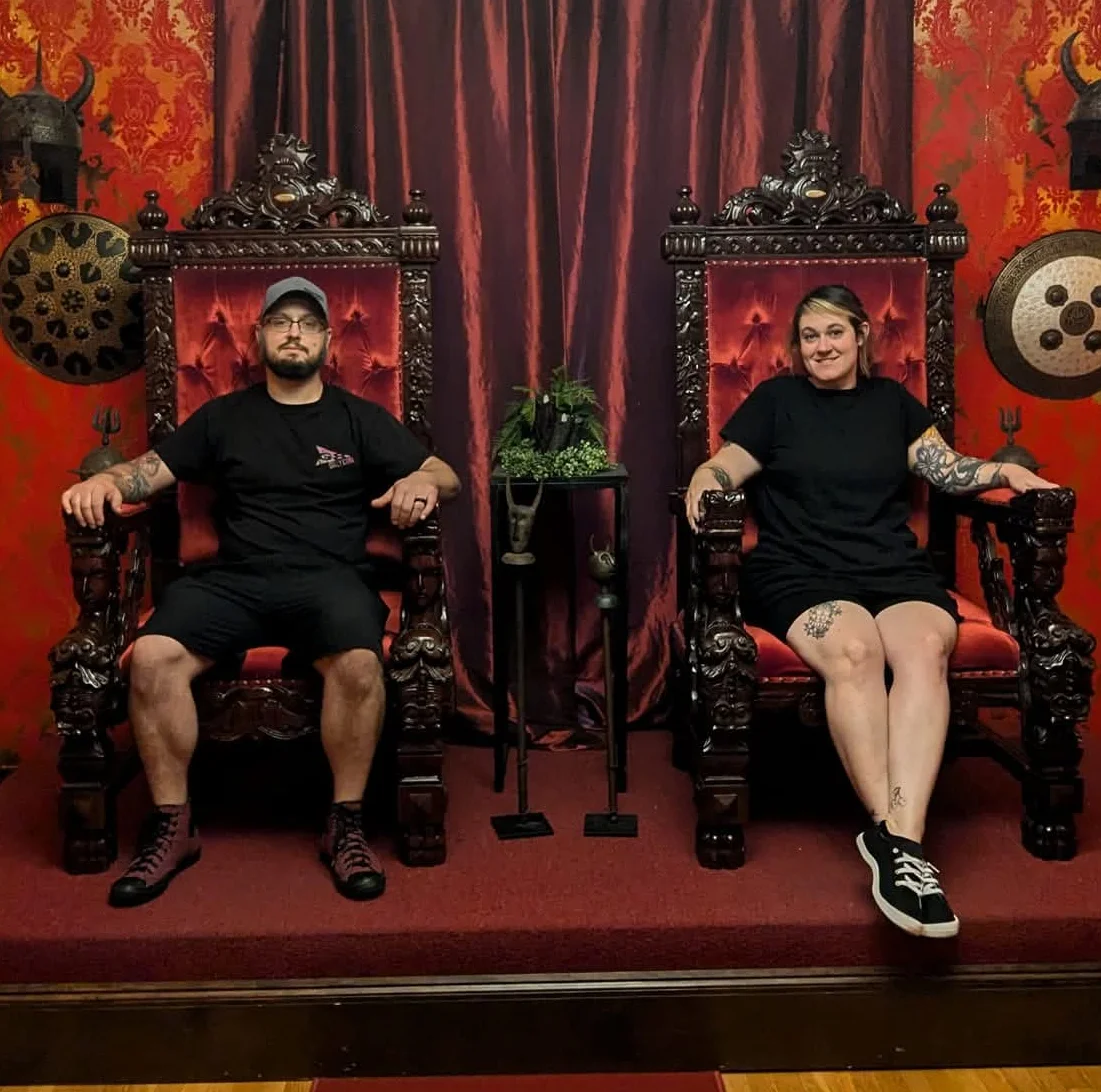 Decorative restaurant interior with ornate thrones and red wallpaper