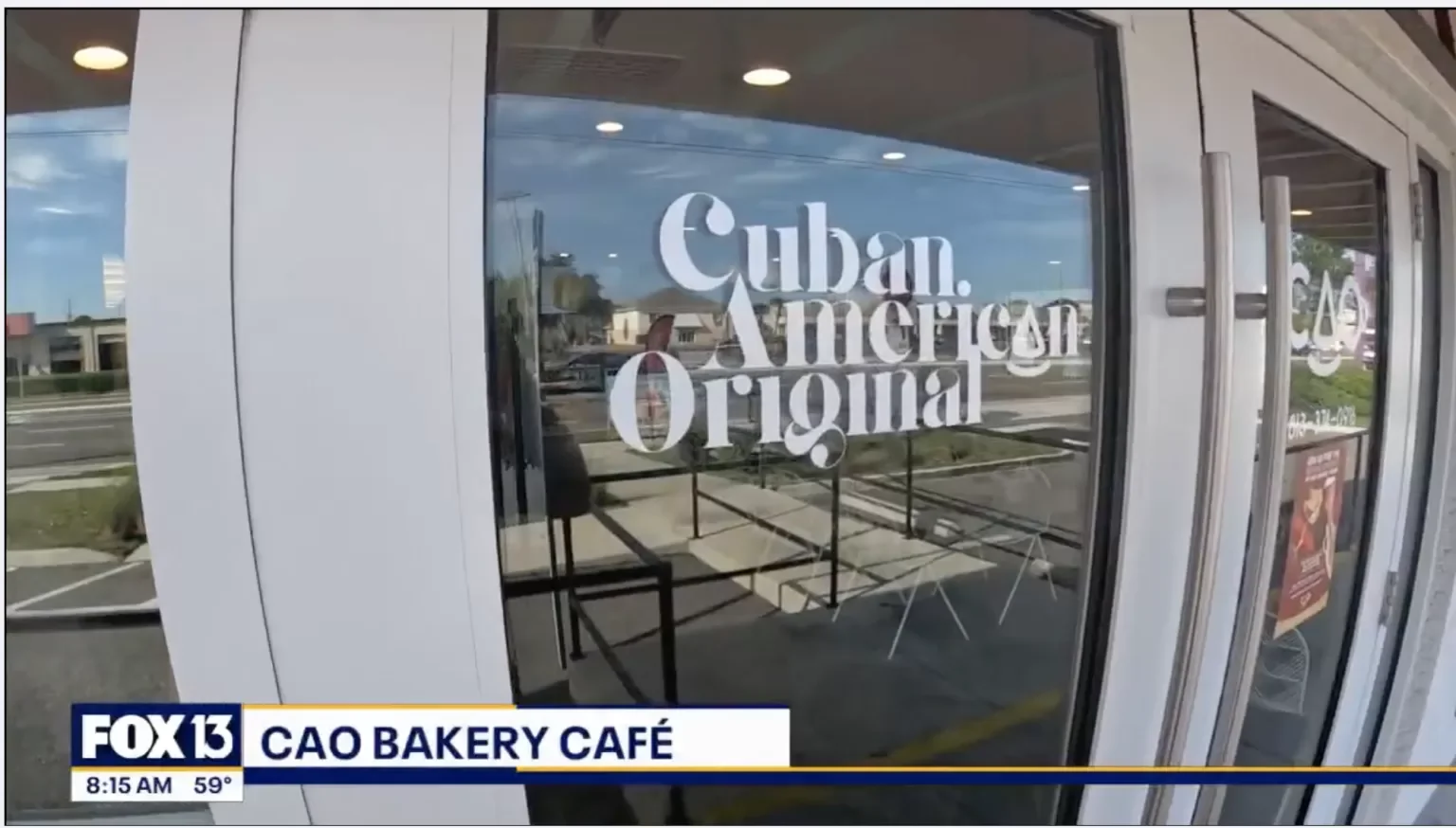 Café entrance featuring Cuban American branding