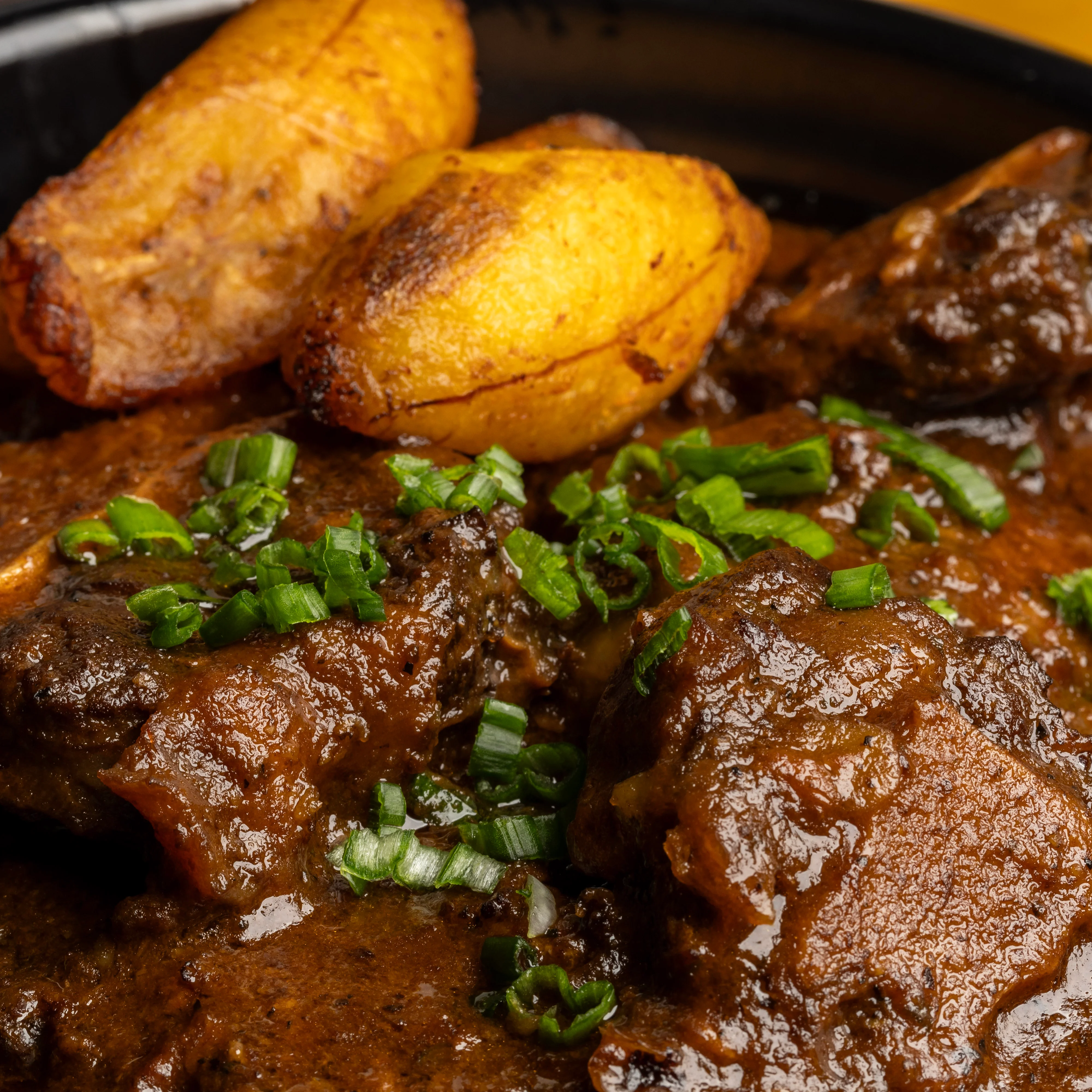 Nigerian egusi soup with plantains and herbs