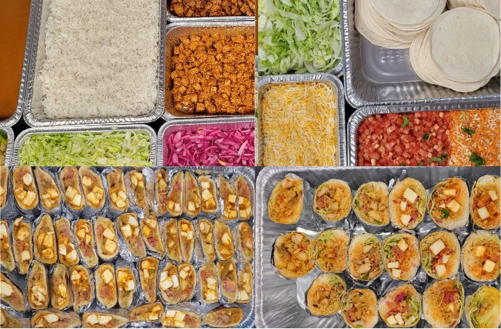 Colorful taco bar setup with various toppings and fillings