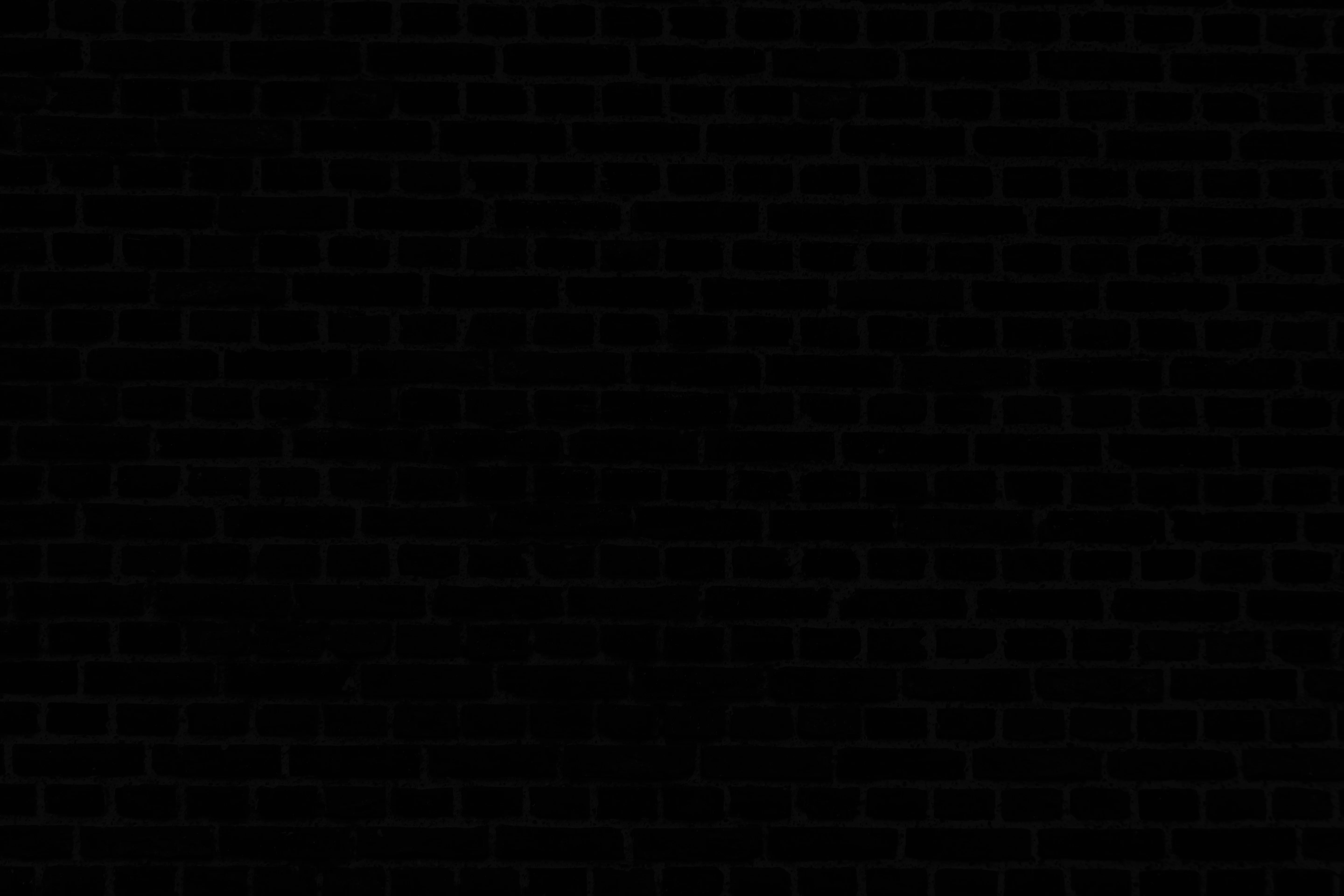 Textured black brick wall background