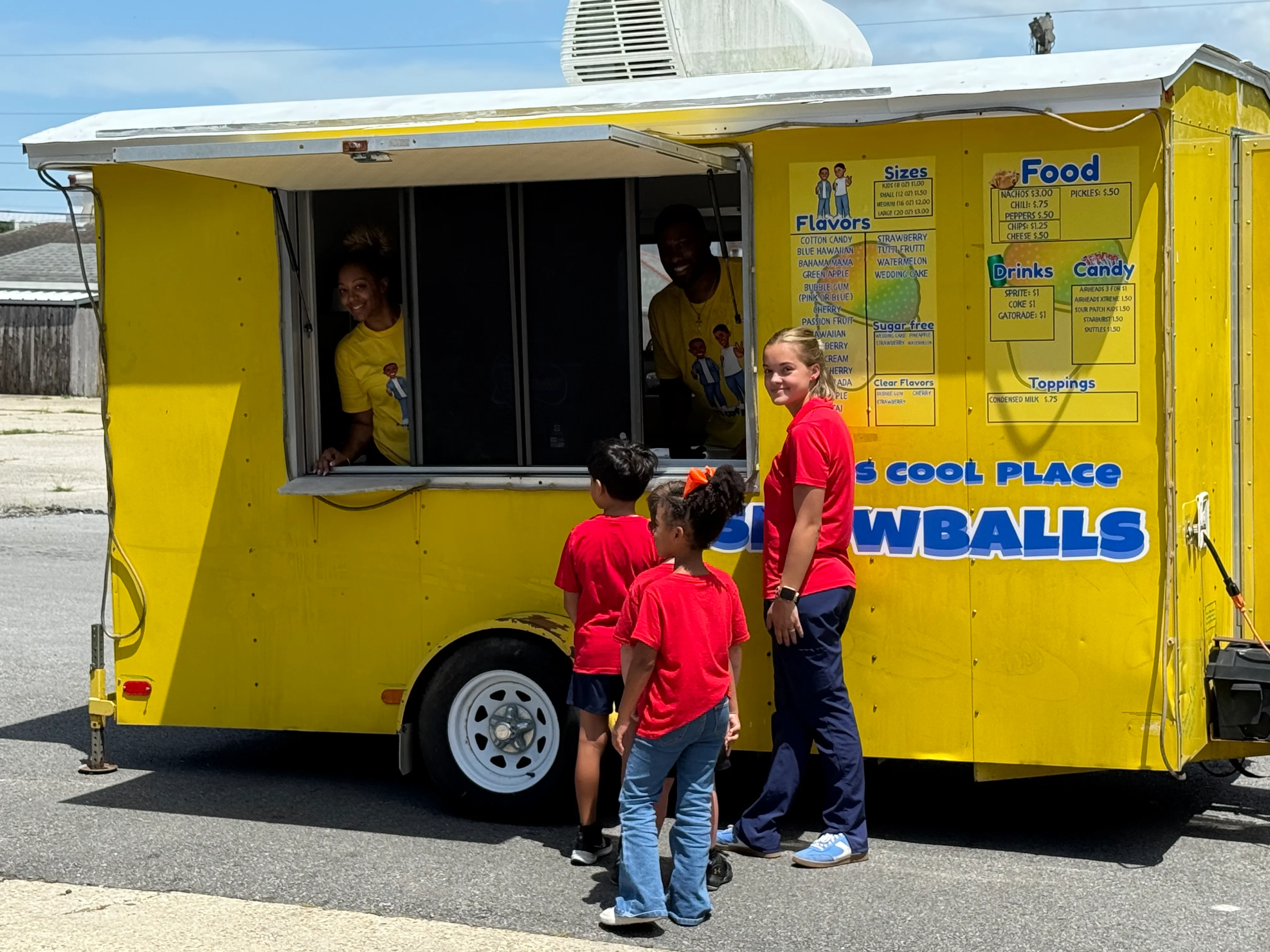Colorful snowball stand serving refreshing treats on a sunny day