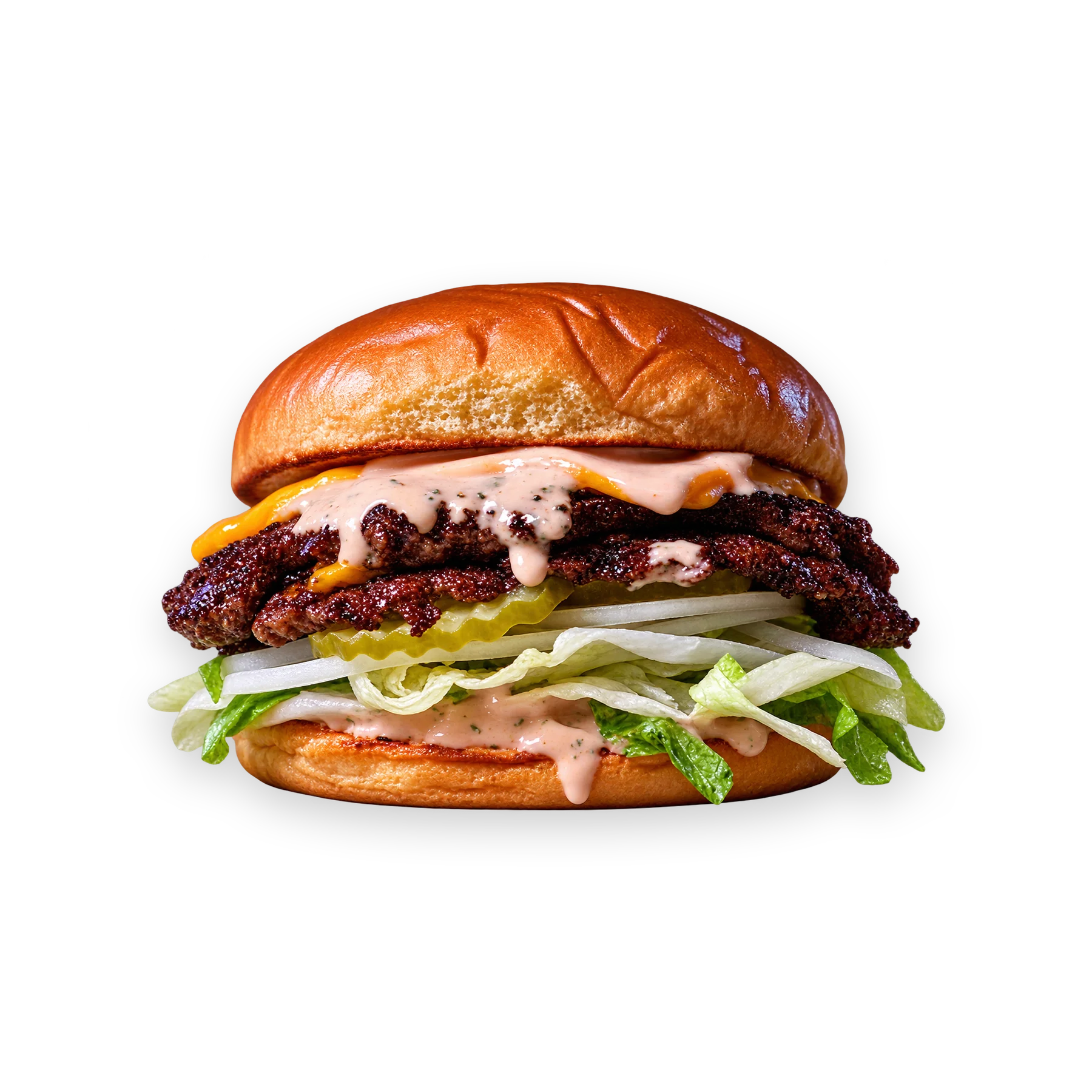 Delicious burger with cheese, sauce, and green onions on a bun