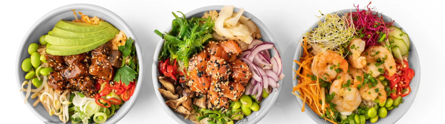 Colorful Asian rice bowls with shrimp and chicken