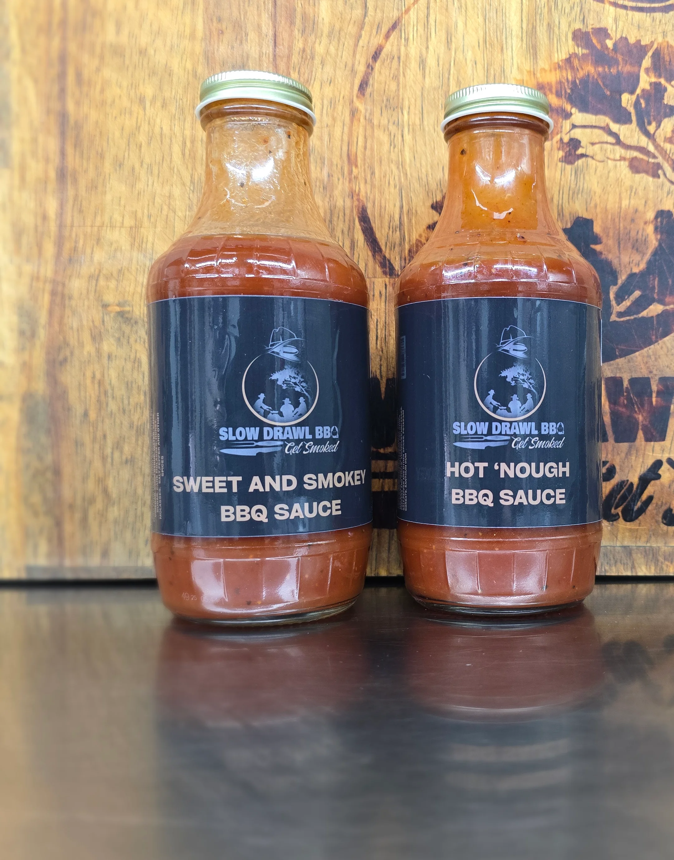 Bottles of BBQ sauce: Sweet and Smoky, Hot 'Nough