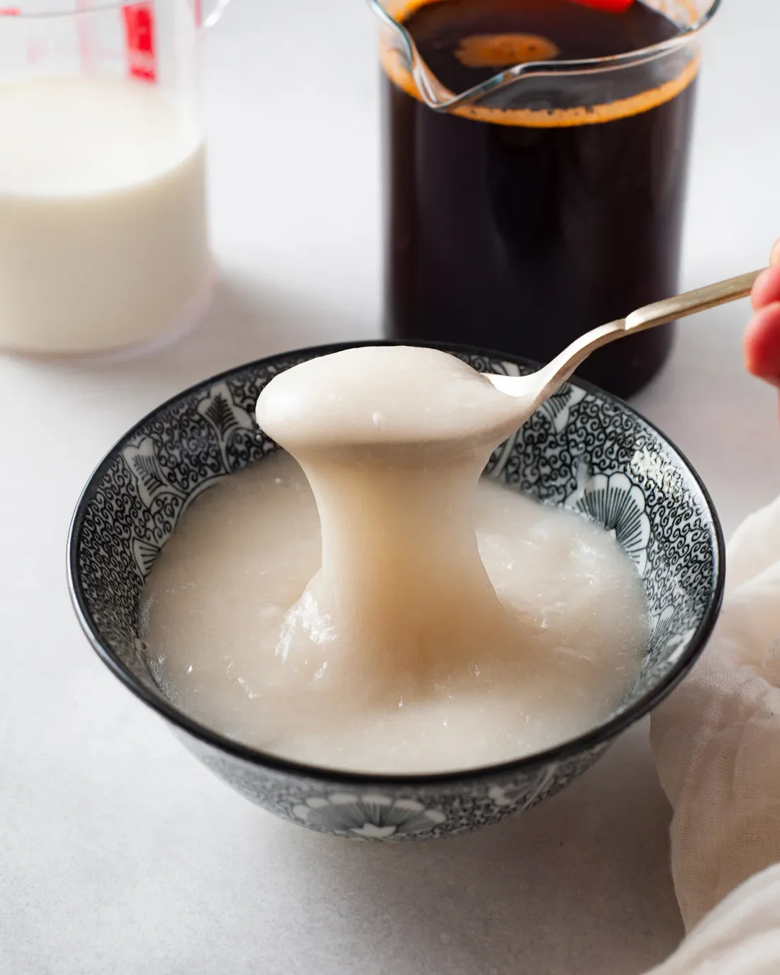 Bowl of Chinese sweet rice pudding with syrup