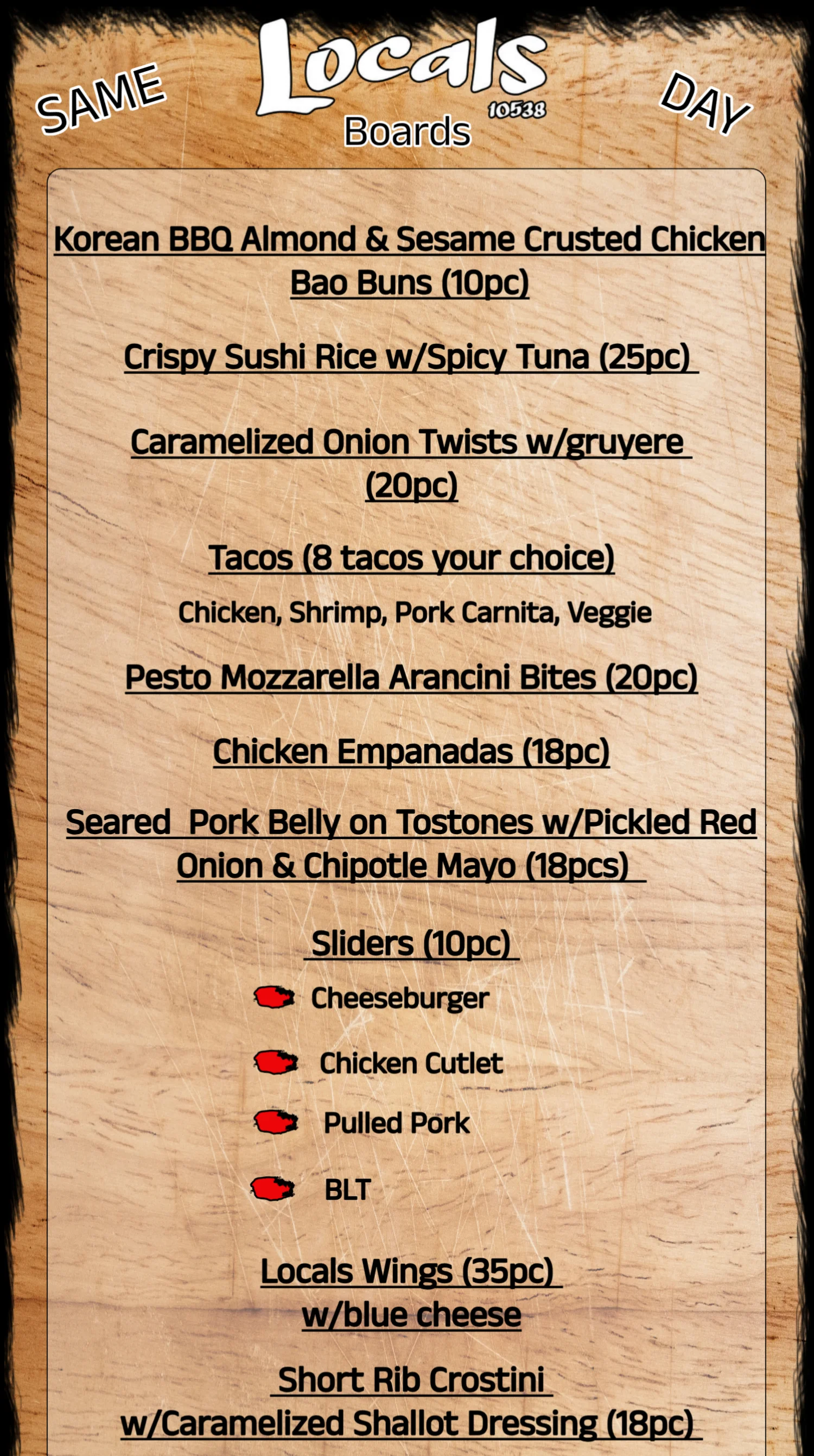 Menu board featuring various appetizers and sliders.
