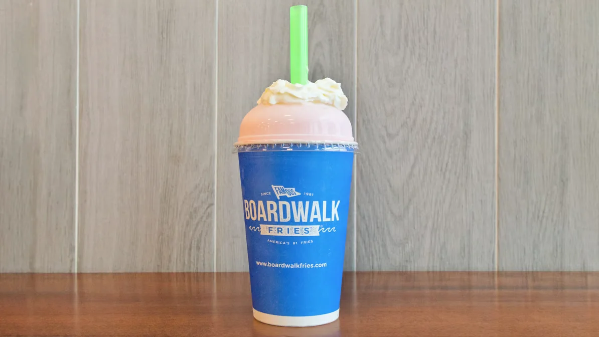 Frosty milkshake topped with whipped cream